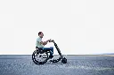 Sagitta Blumil GO with person road - side view white sky.webp
