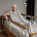 Mattress-encompassing nursing blanket