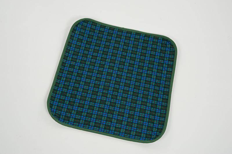 Impermeable absorbent seat pad