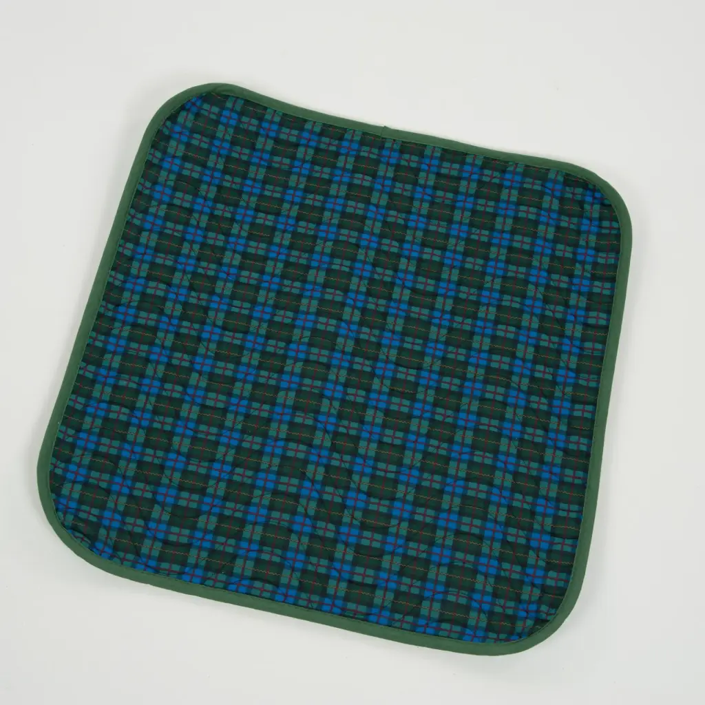 Impermeable absorbent seat pad