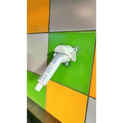 Tubenijper met zuignappen