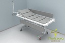 Shower / care table electrically adjustable in height