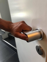 Double-acting door handle for people with wandering behavior