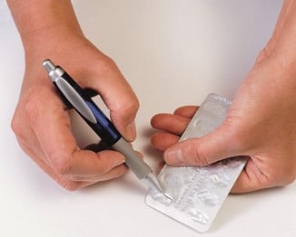 Pen shaped pill remover